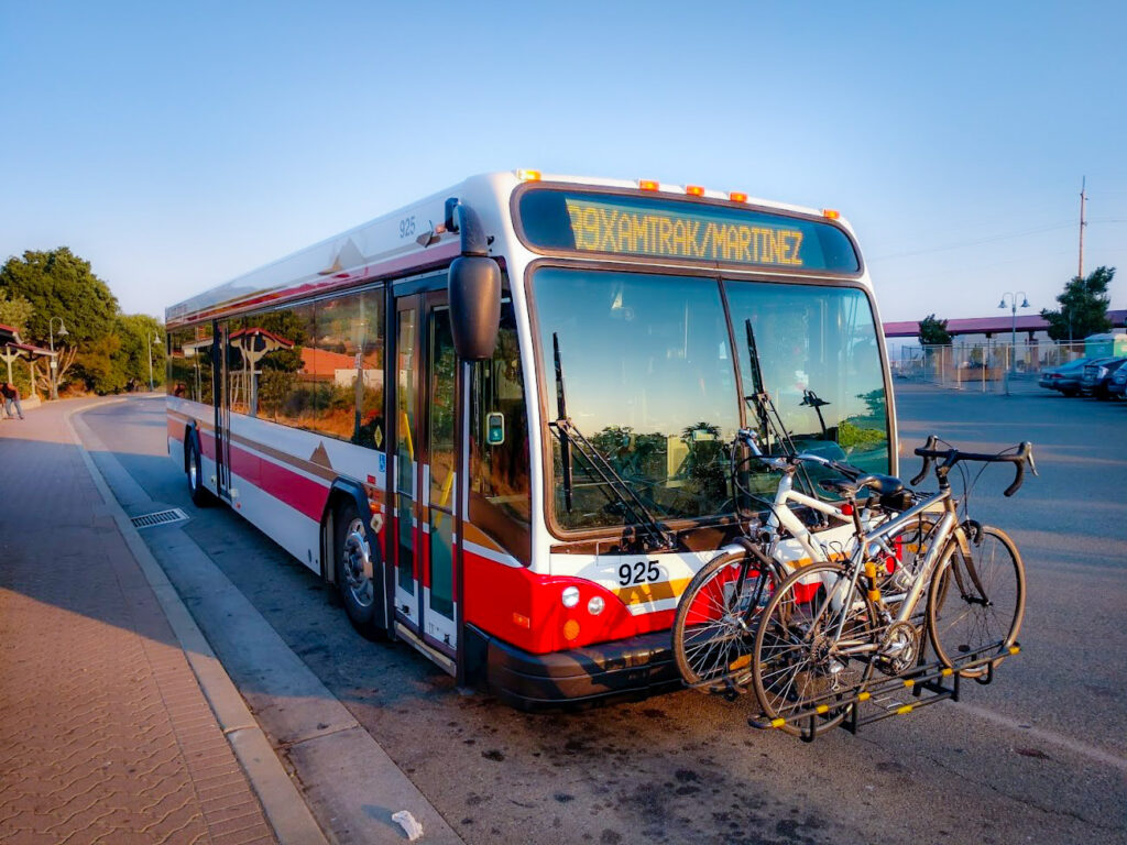Image of County Connection Bus, Route 99X with bicycles on front rack.