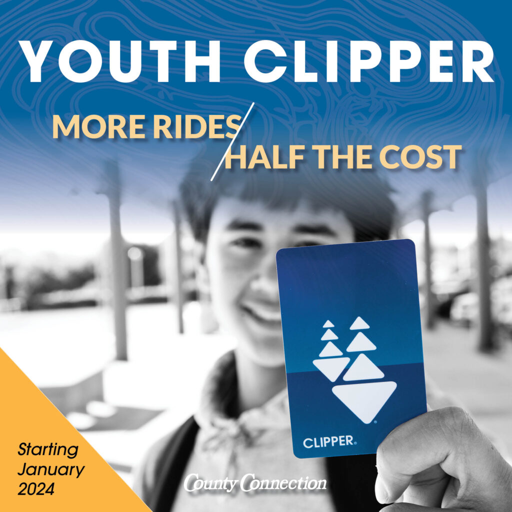 Image of a boy holding a Clipper card.
