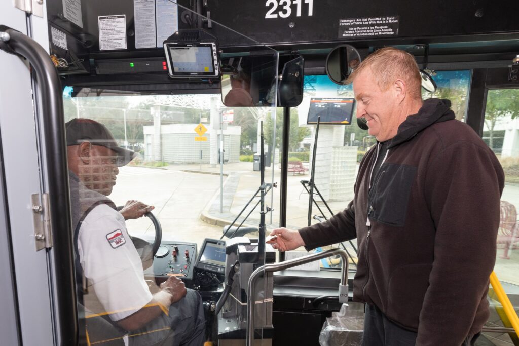 Passenger boarding a County Connection bus.