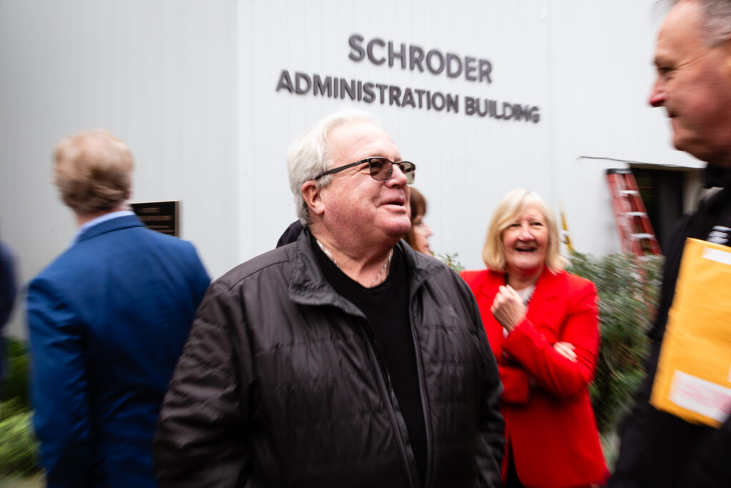 Image of Rob Schroder in front of Schroder Administration Building at County Connection.